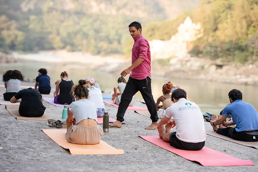 Yoga teacher training class next to the river